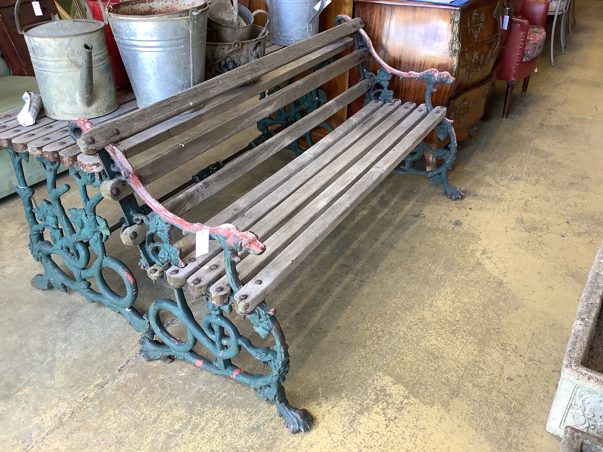 A Victorian Coalbrookdale painted cast iron Serpent and Grape pattern slatted garden bench and table, bench with cast hounds head terminals, table W-160, D-55, H-64, bench W-160, D-65, H-76cm.